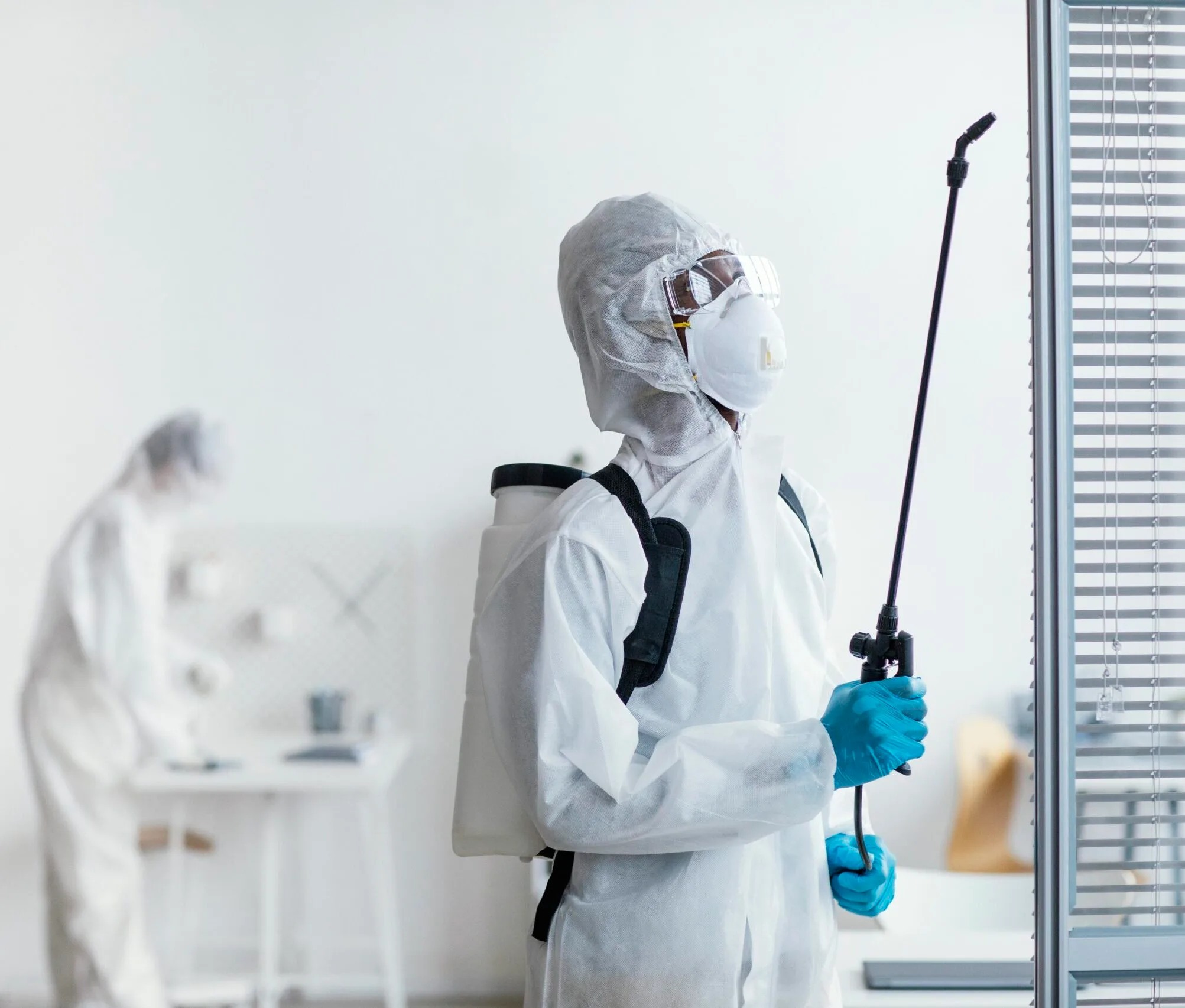 people-disinfecting-together-dangerous-area